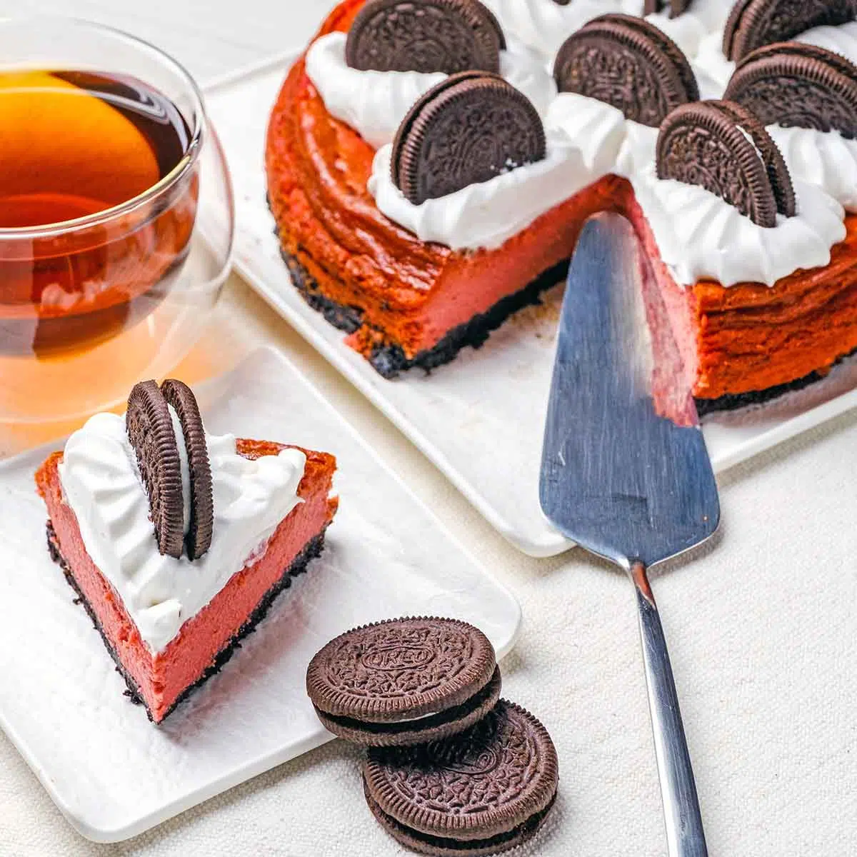 Slice of cheesecake with full cake in the background