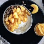 A bowl of yogurt topped with compote.