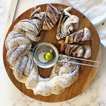Top down view of braided Nutella bread with a few slices cut out