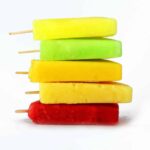 A stack of different flavored popsicles.