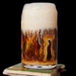 Sweet cream cold foam melting into ice cofee.