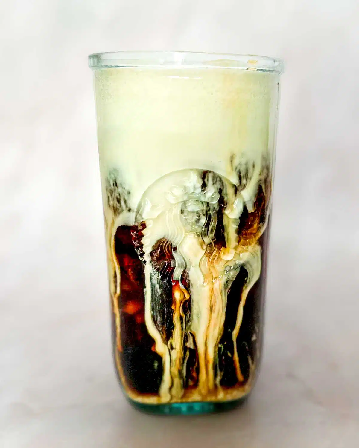 Shaken brown sugar espresso with vanilla sweet cream cold foam melting into it.