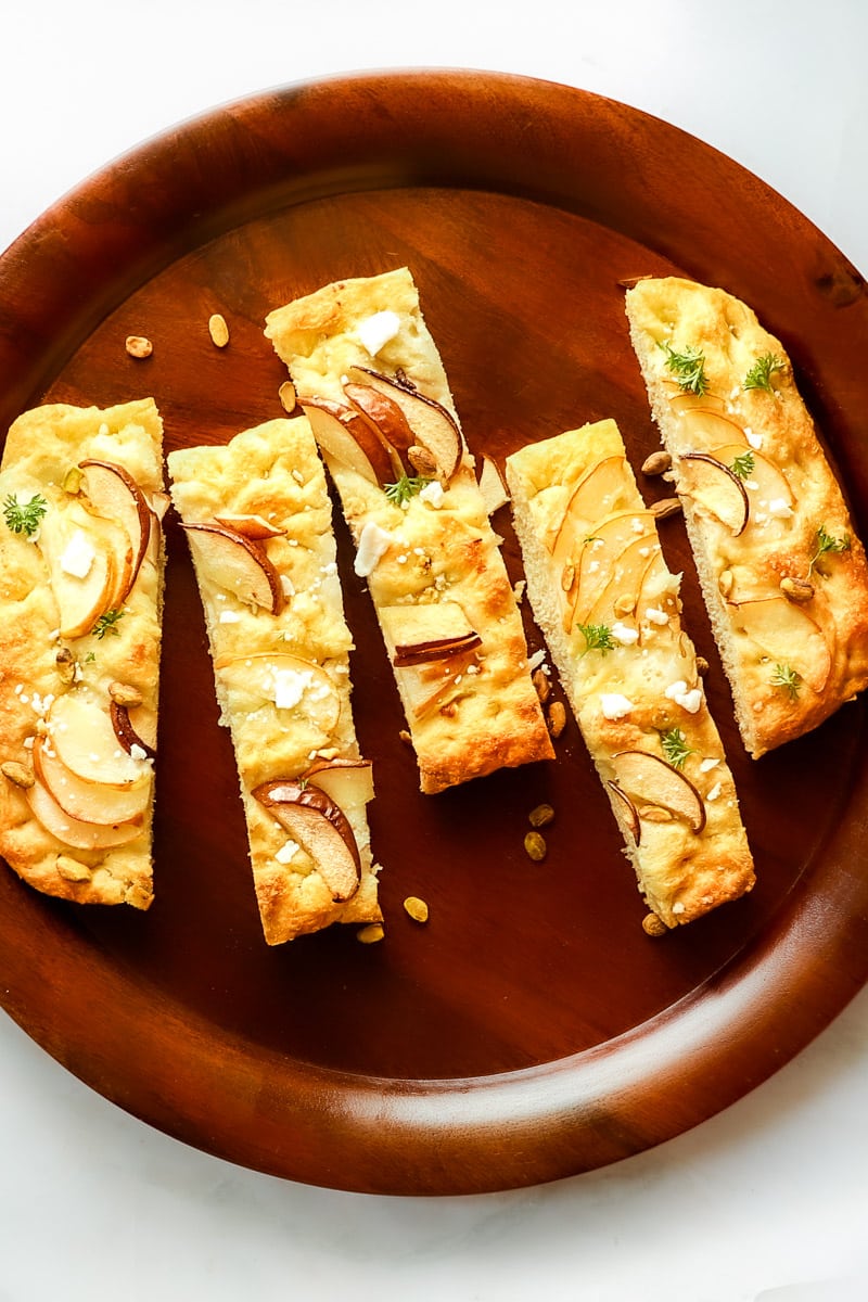 Five slices fo pear and blue cheese focaccia bread.