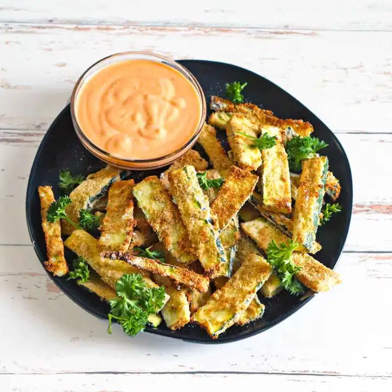 A plate of zucchini fries and sriracha aioli