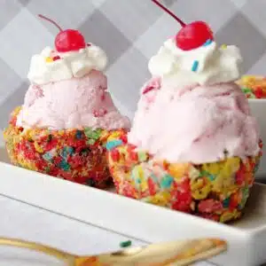Two cereal cups filled with ice cream.