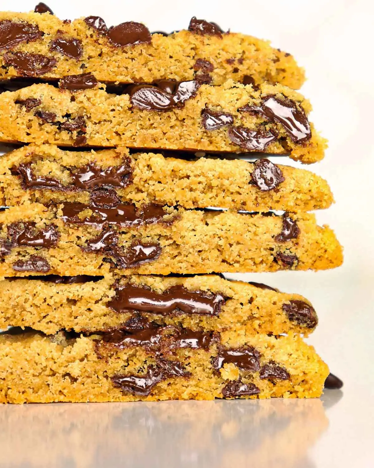 An up-close view of Peanut Butter Chocolate Chip Cookies cut in half and stacked.