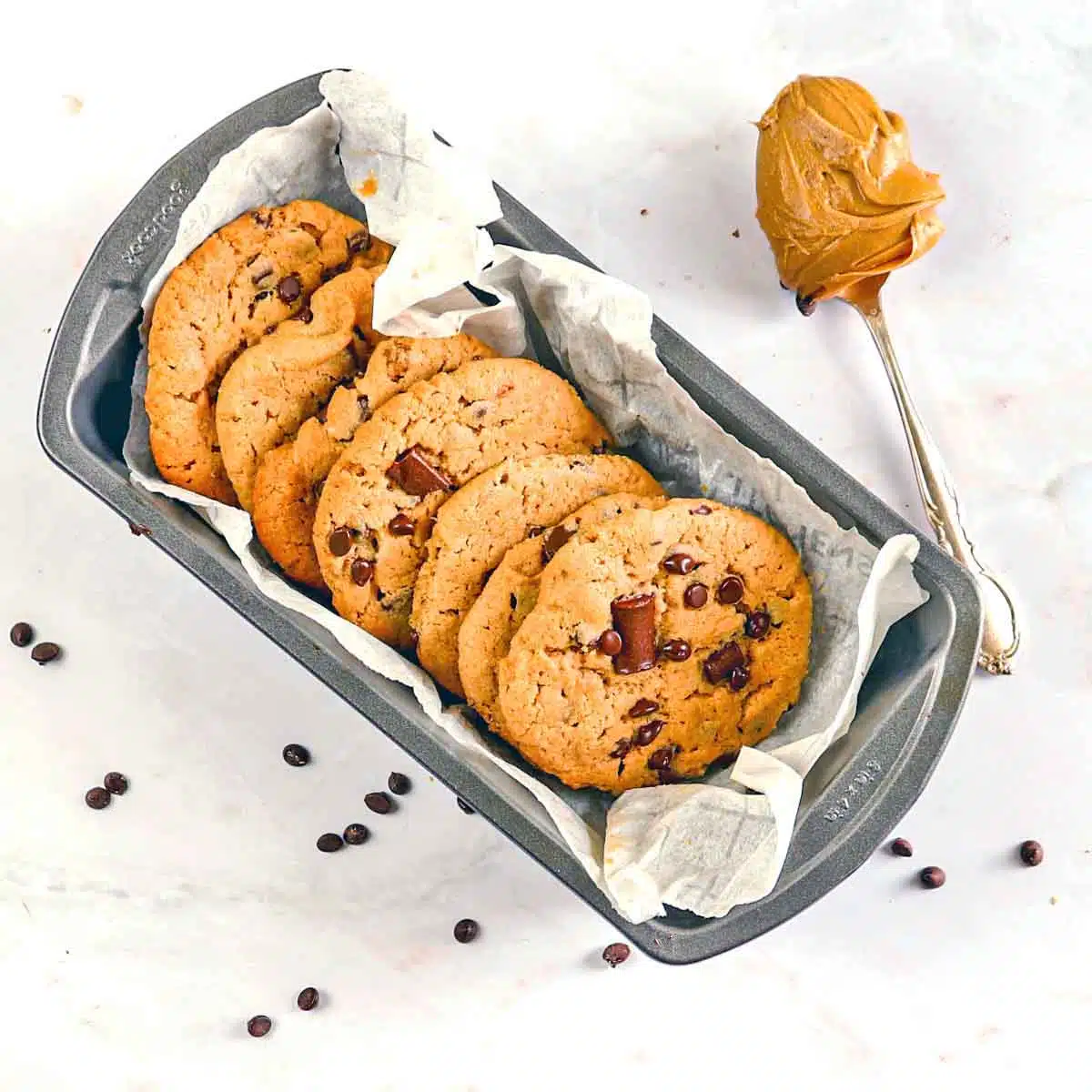 A row of cookies in a bread pan.