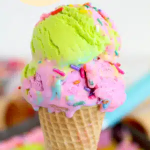 Two scoops of ice cream in a waffle cone.