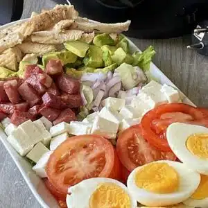 Salad arranged in rainbow colors.