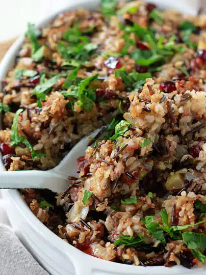 Stuffing in a bowl with a serving spoon. 