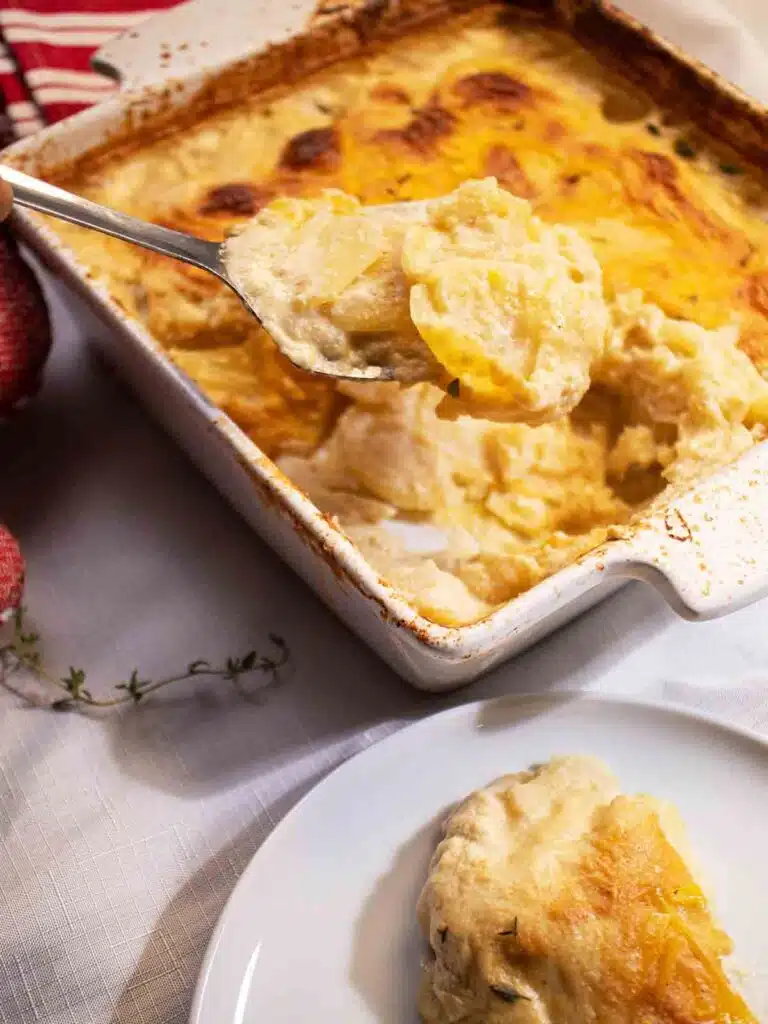 Baked scallop potatoes in a casserole dish.