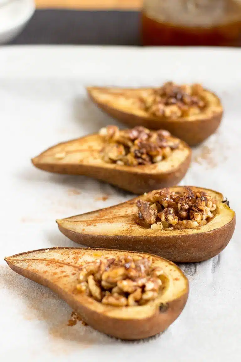 Four pears filled with walnuts.