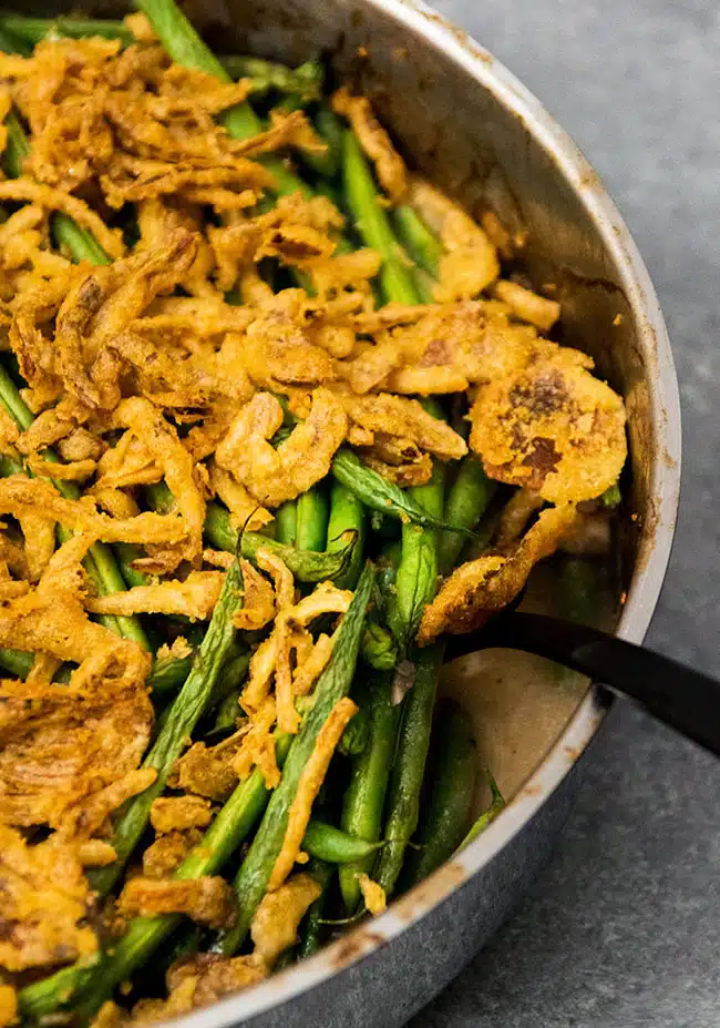 Green bean casserole with a spoon in it. 