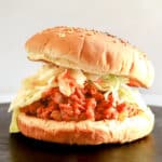 Sloppy Joe on a bun with coleslaw.