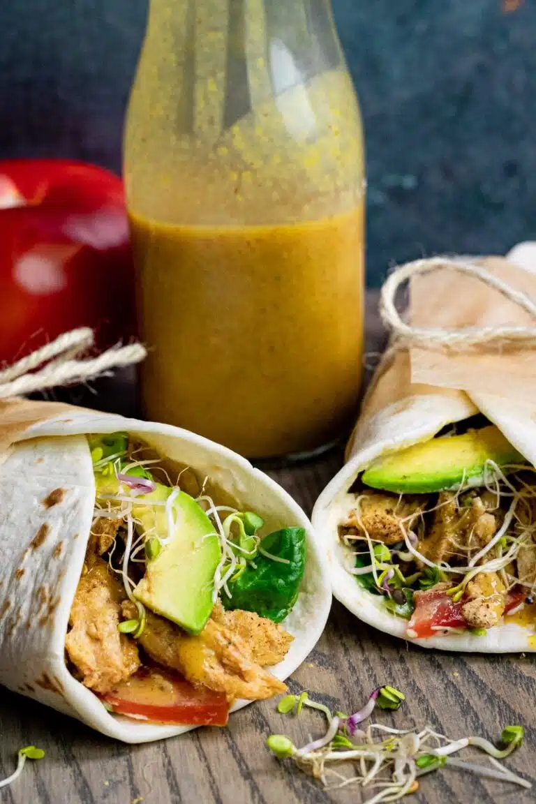 Two wraps with a craft of honey mustard between the wraps. 