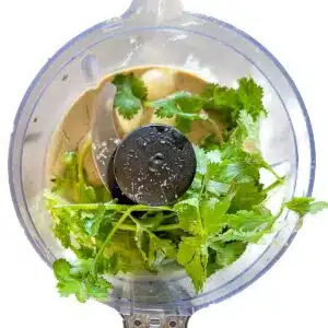 Ingredients in the food processor before being processed.