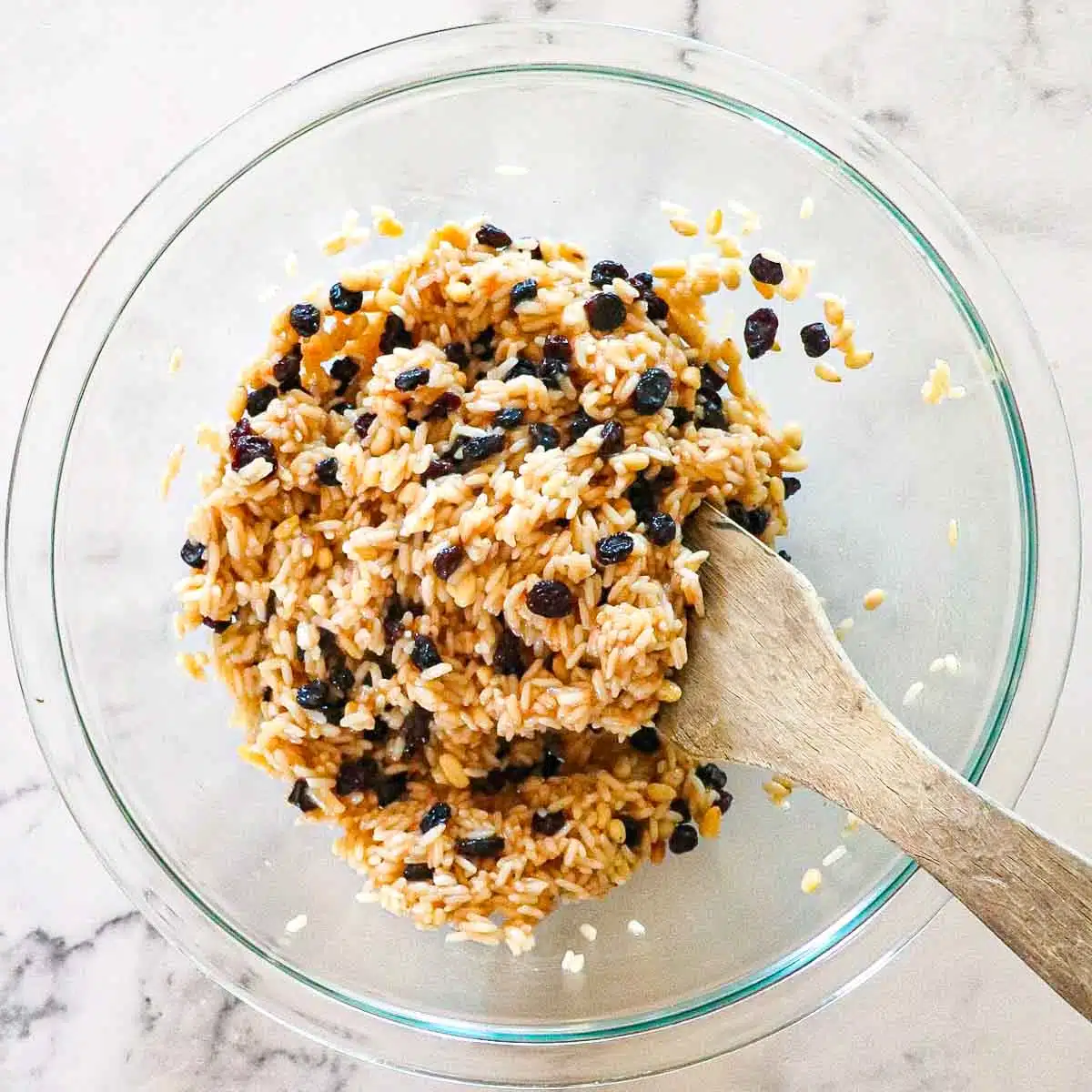 Filling ingredients mixed together with a wooden spoon. 