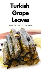 A stack of grape leaves on a Pinterest pin.