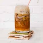 Iced Brown Sugar Oat Milk Shaken Espresso in a glass on top of coasters