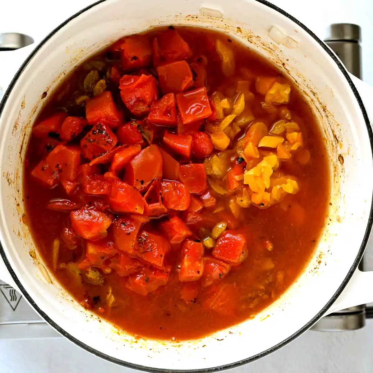 Tomatoes and broth added.