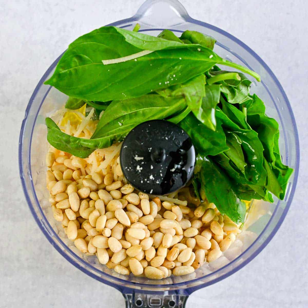 Lemon pesto in a small food processor before being blended.