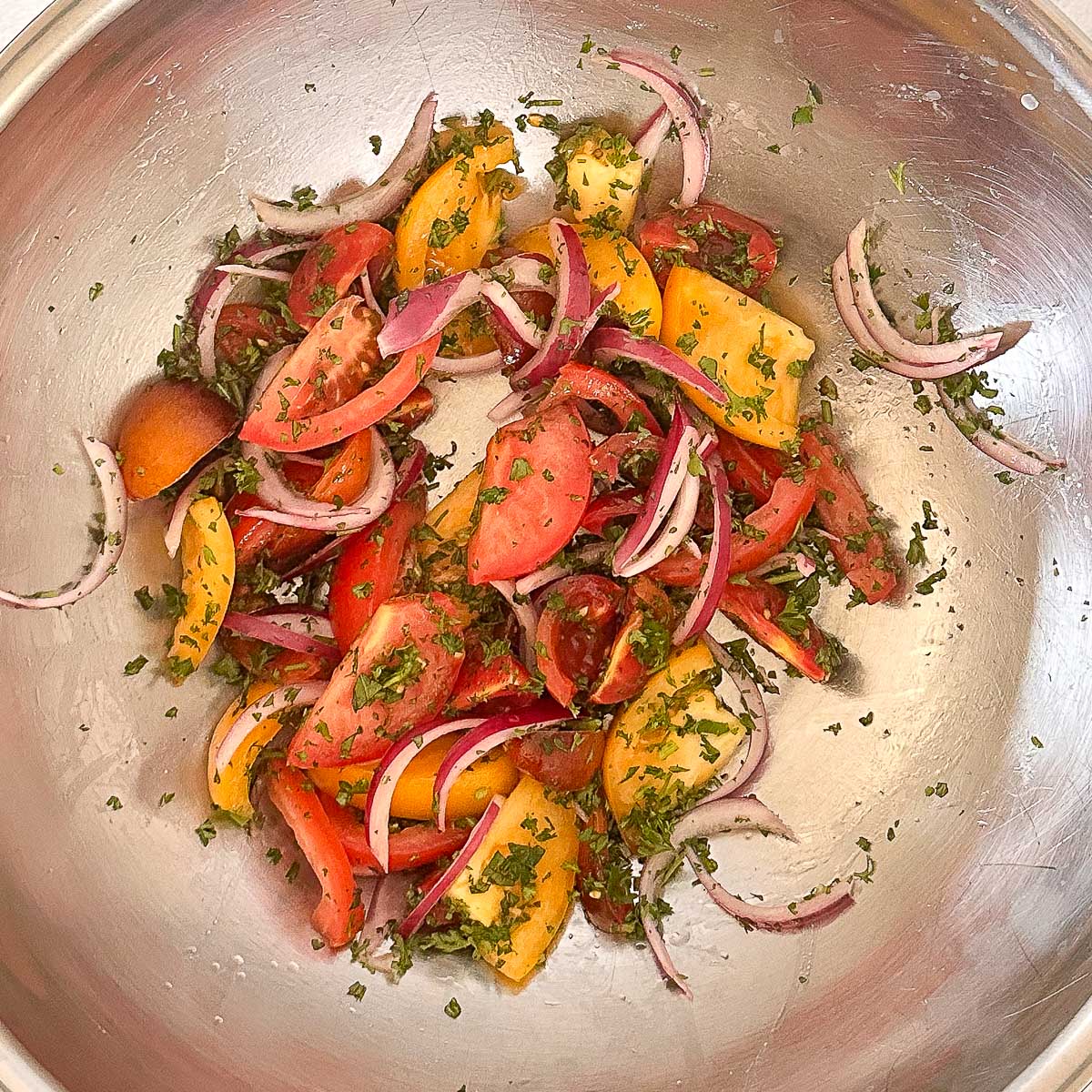 Ingredients tossed together in a mixing bowl