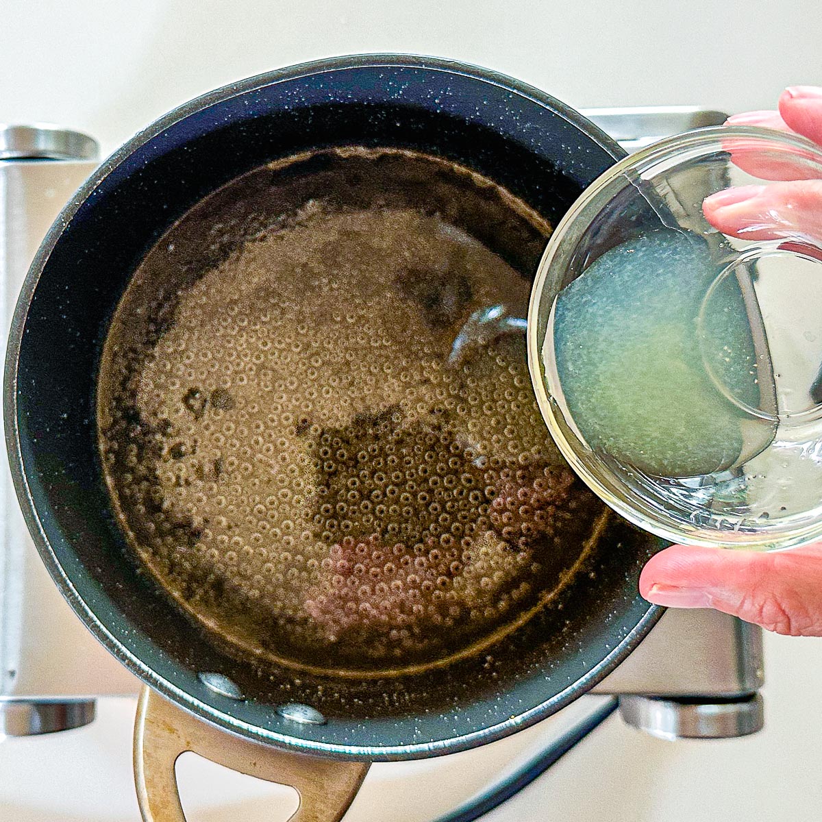 Adding lemon juice to simple syrup for pistachio baklava.