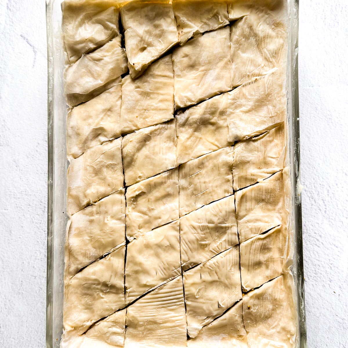 Baklava cut into diamonds before going into the oven.