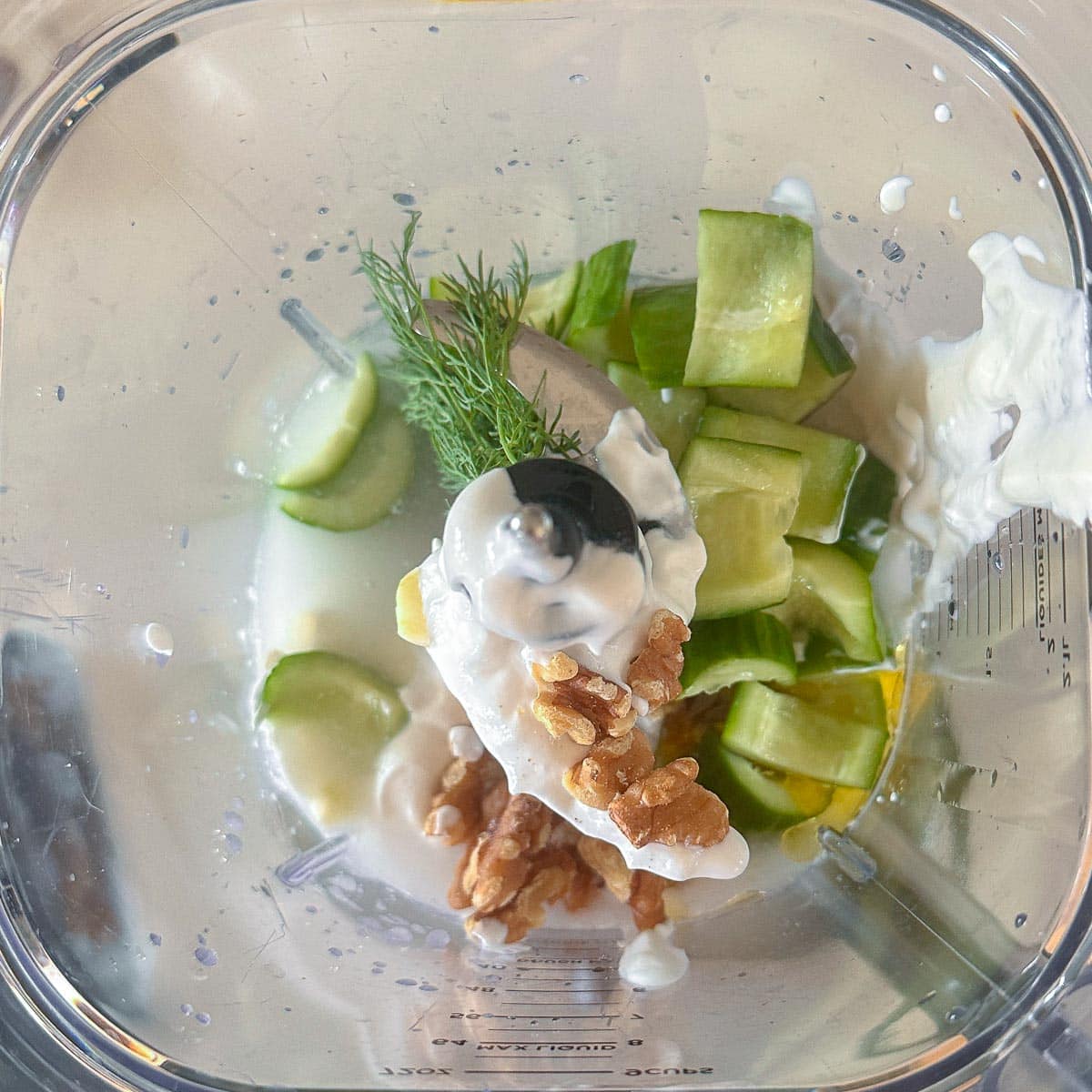 Ingredients for tarator soup in a blender before being blended together. 