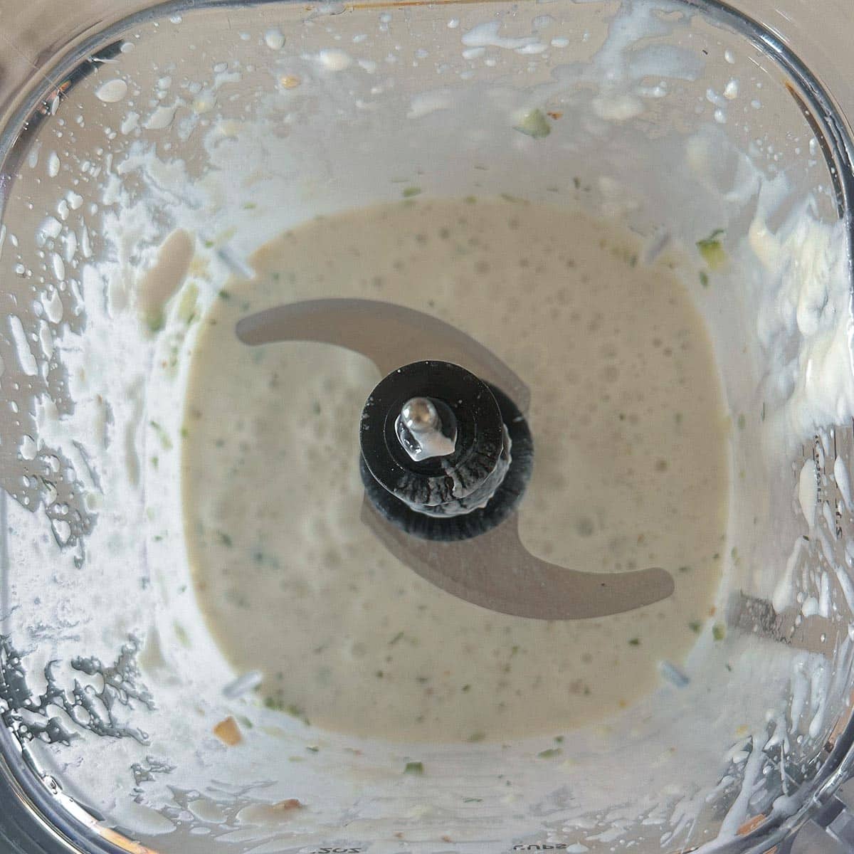 Ingredients for tarator soup in a blender after being blended together. 