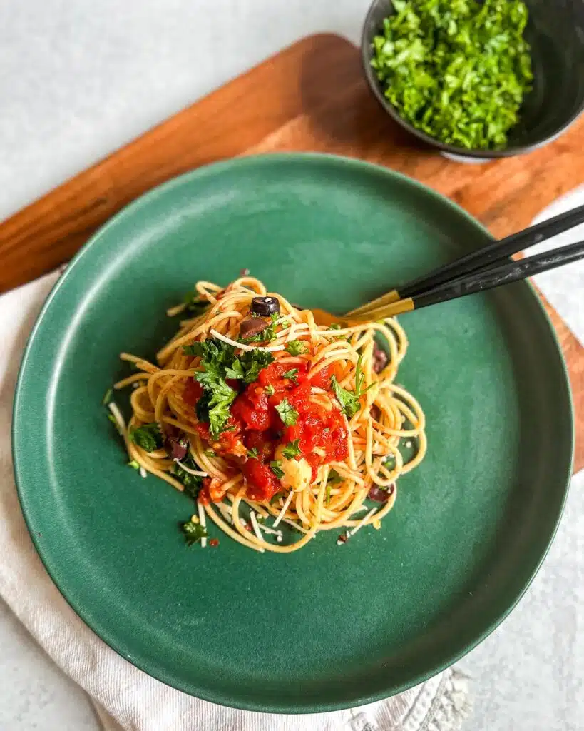 Vegan Spaghetti all’Arrabbiata served on a plate, garnished with fresh parsley.