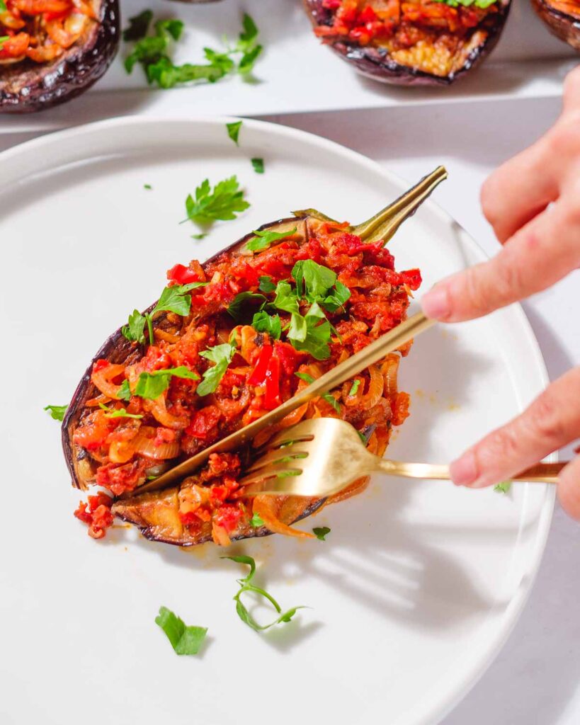 Cutting into Imam Biladyi with a knife and a fork.