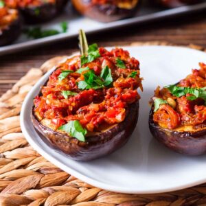 Imam Biladyi on a white plate garnished with flat Italian parsley.