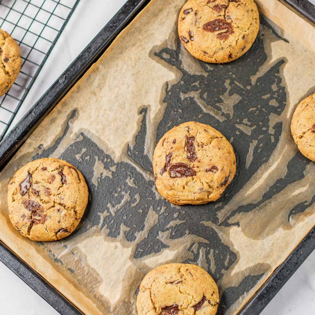 Baked vegan tahini cookies on a tray.