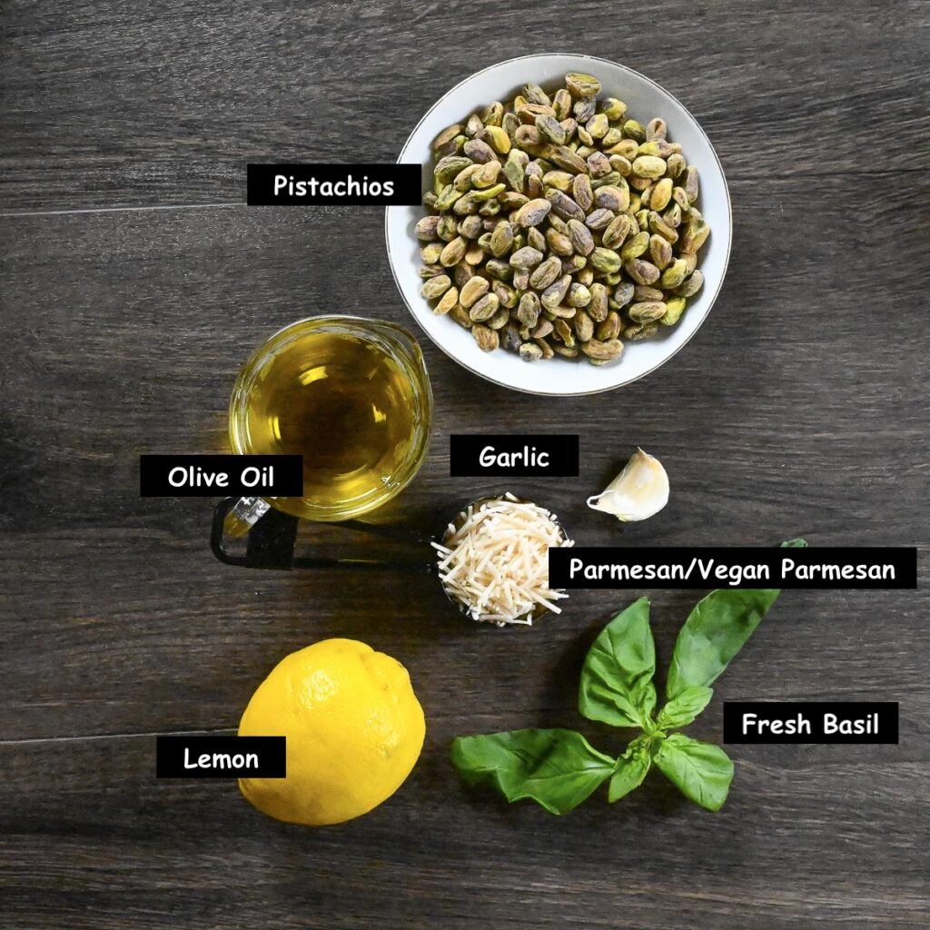 Ingredients used in making pistachio basil pesto (Toasted pistachios, olive oil, garlic, lemon, fresh basil, parmesan or vegan parmesan)