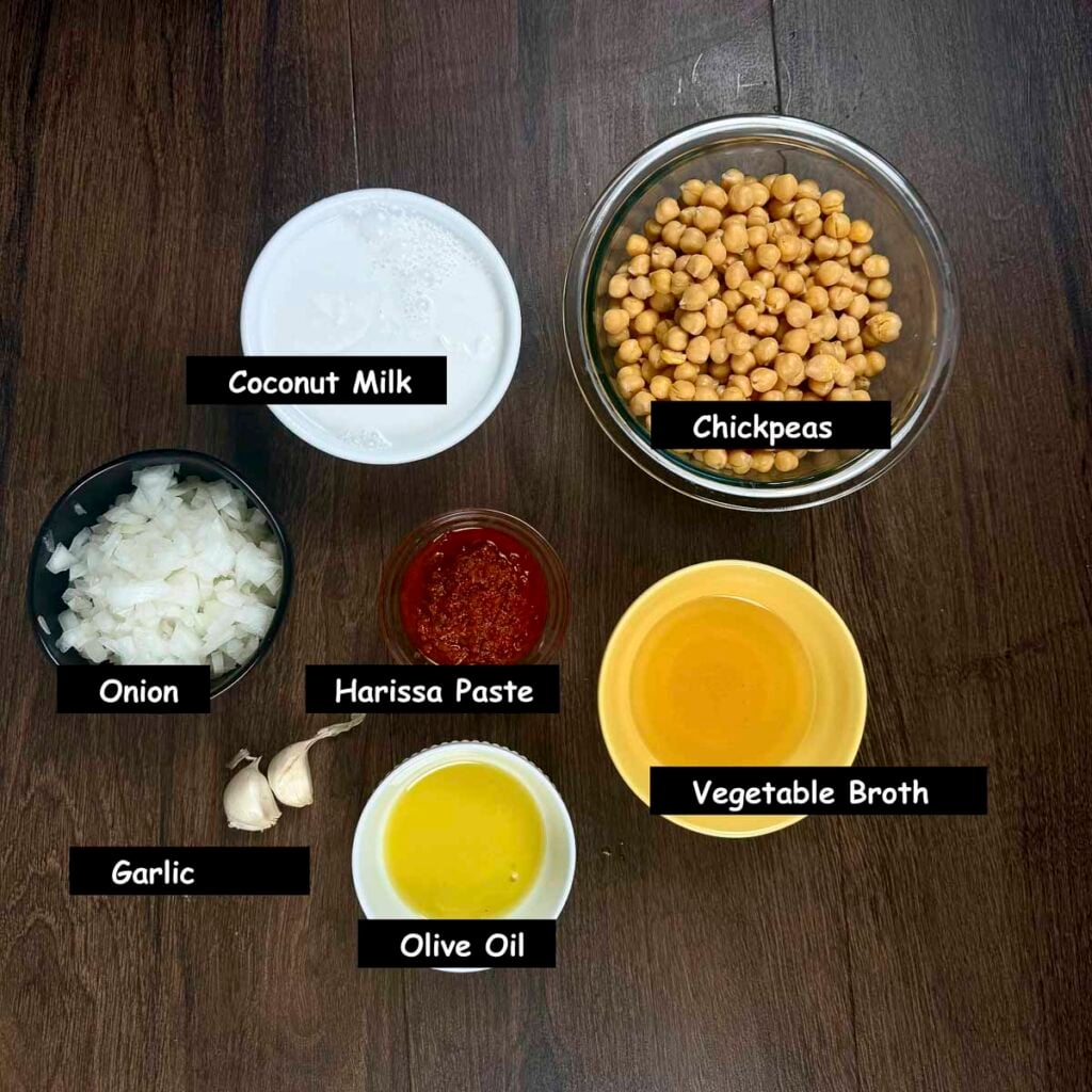 Ingredients used to make spicy harissa chickpeas (chickpeas, harissa paste, coconut milk, onions, garlic, olive oil and vegetable broth.)