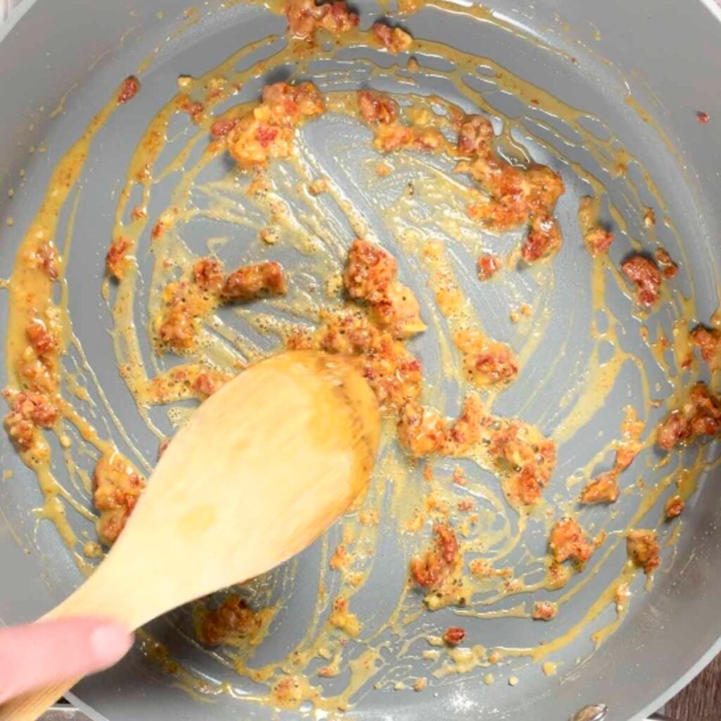 Garlic, sun-dried tomatoes, and flour sautéd in butter to make vegan pasta with sun-dried tomatoes.