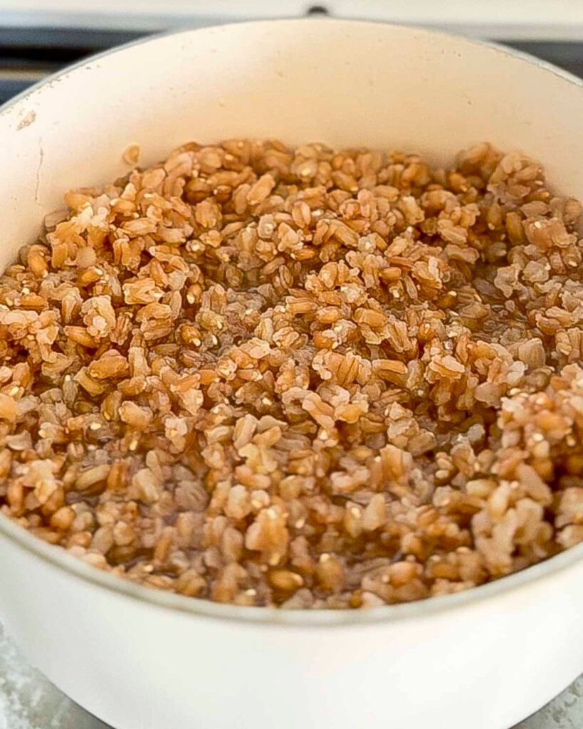 Cooked farro in a small saucepan.