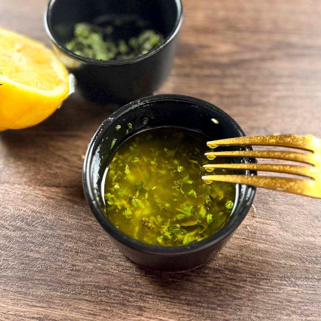 Olive oil, lemon, garlic and oregano salad dressing for the grilled peach panzanella salad.