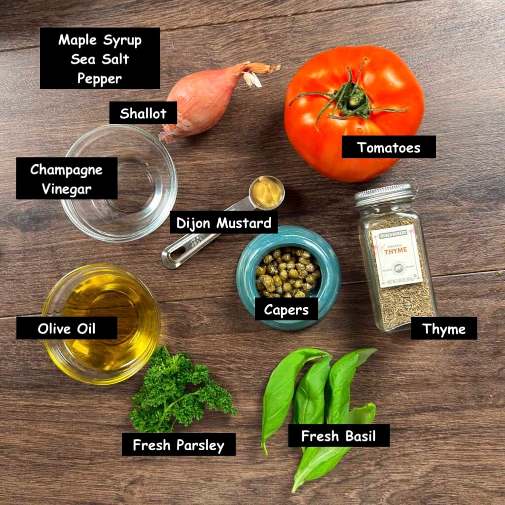 Ingredients used in making marinated tomatoes (tomatoes, shallot, olive oil, champagne vinegar, capers, Dijon mustard, thyme, parsley, and basil