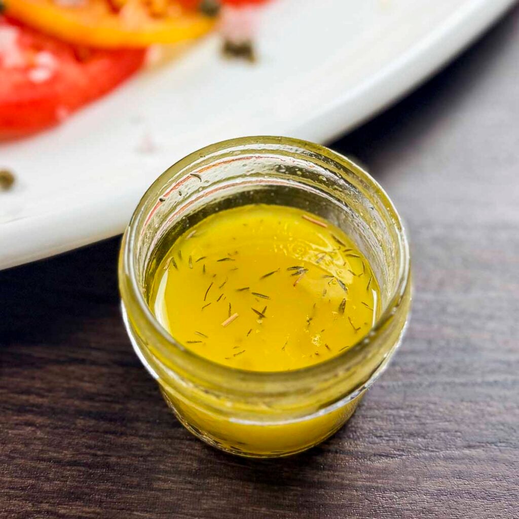 Champagne vinaigrette in a small mason jar.