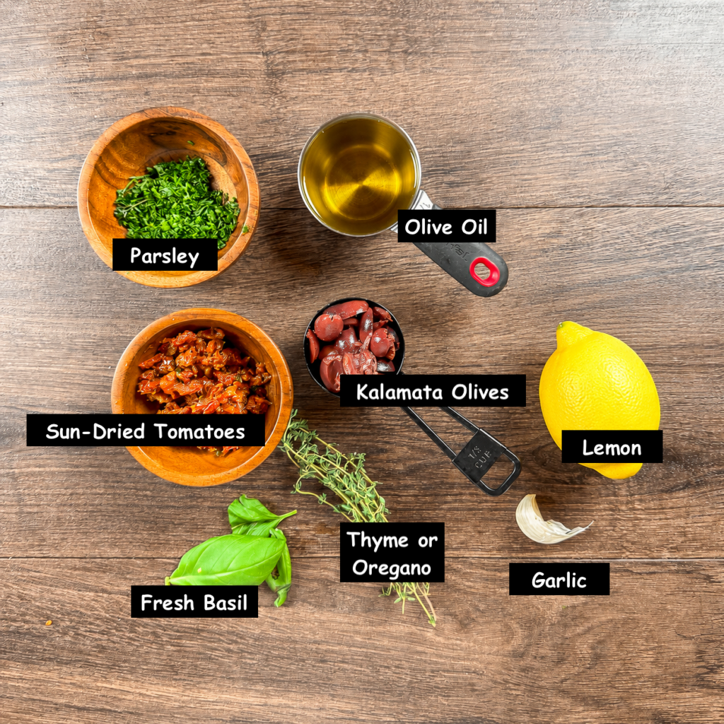 Ingredients used in making an olive oil bread dip (Olive oil, Kalamata olives, sun-dried tomatoes, parsley, lemon, garlic, fresh basil, and thyme or oregano.)