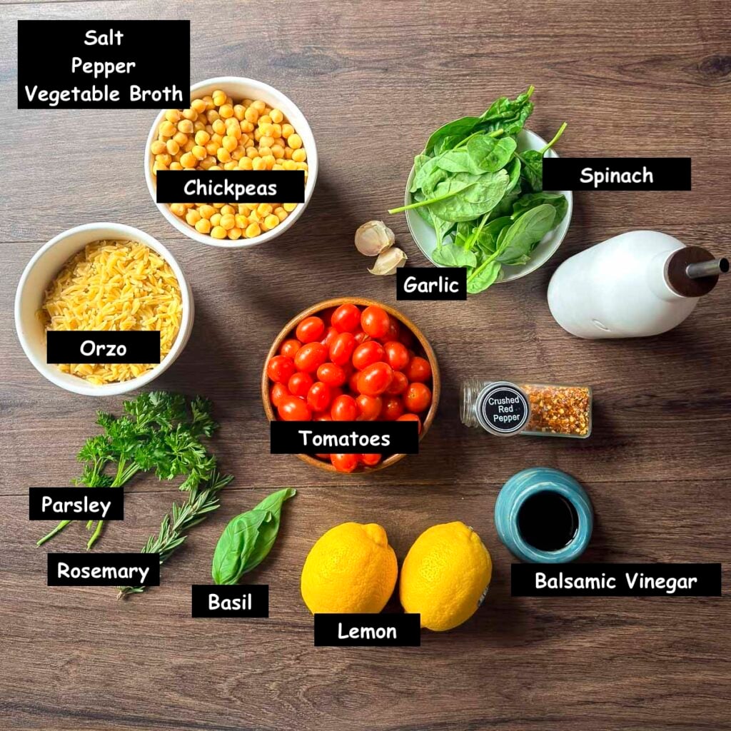 Ingredients used in making this chickpea orzo plant-based dinner (chickpeas, orzo, fresh spinach, grape tomatoes, olive oil, garlic, crushed red pepper, balsamic vinegar, fresh lemon, basil, rosemary, parsley, salt, pepper, and vegetable broth).