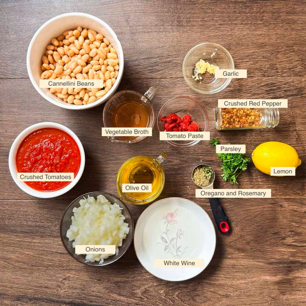 Ingredients used in making Mediterranean white beans (Cannellini beans, crushed tomatoes, onion, garlic, crushed red pepper, vegetable broth, olive oil, white whine, lemon, parsley, dried oregano, and fresh rosemary.)